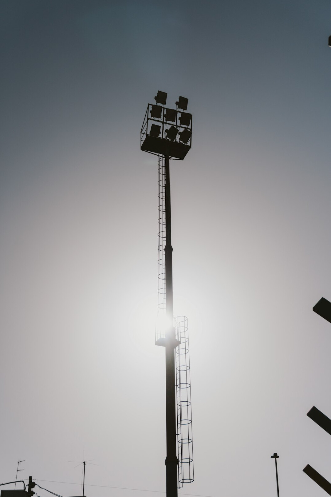 Packed football stadium under bright floodlights